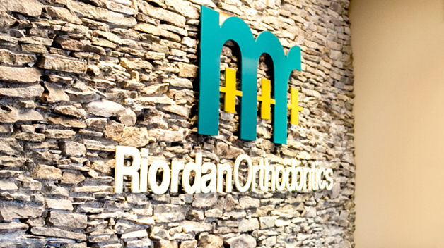 Michael-Riordan-DMD-Office-sign-on-stone-wall