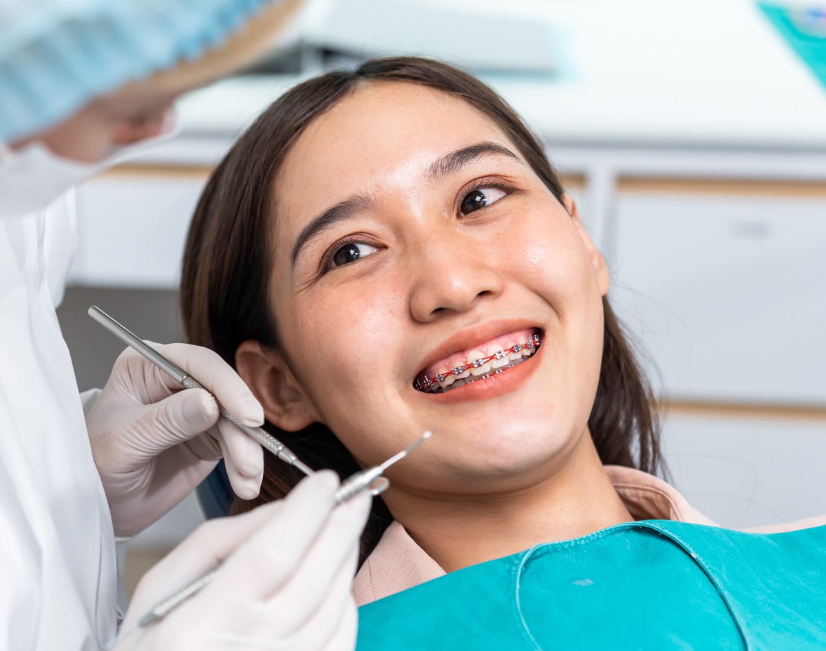 Michael-Riordan-Orthodontics-smiling-girl-with-braces